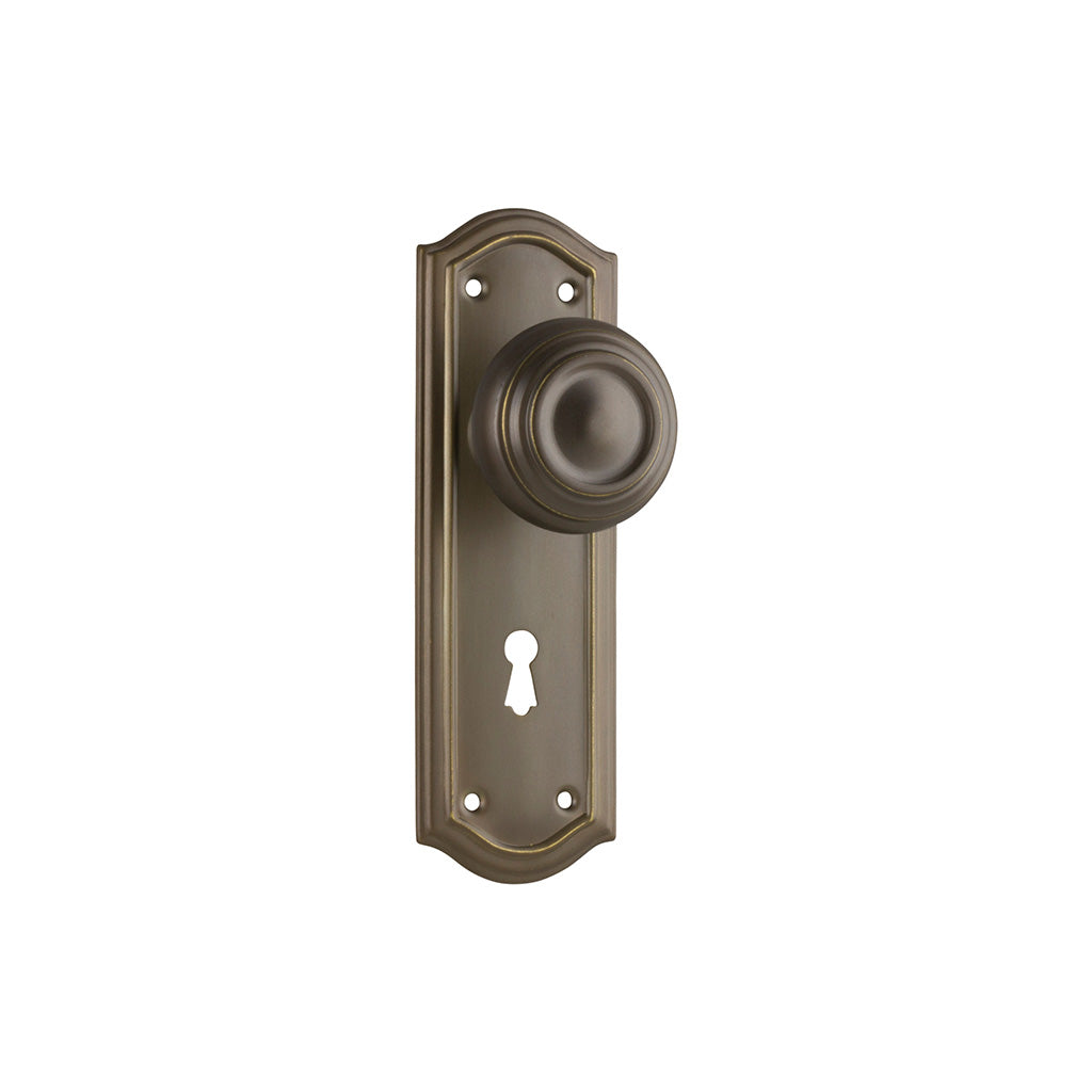 Kensington Door Knob - Long Backplate Antique Brass / Lock (Skeleton Key) / Lever Set Only